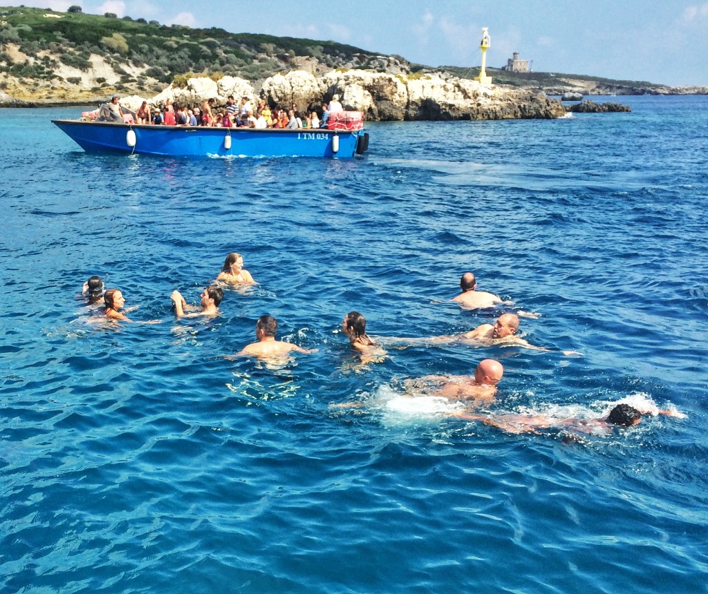 Travelers taking a swim during a boat tour around the Tremiti Islands of Gargano.